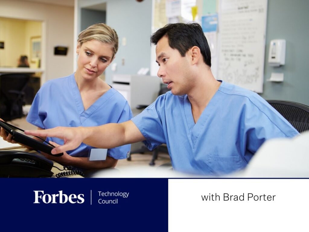 Banner image for Brad Porters' Forbes article: Image of 2 clinicians at computer.