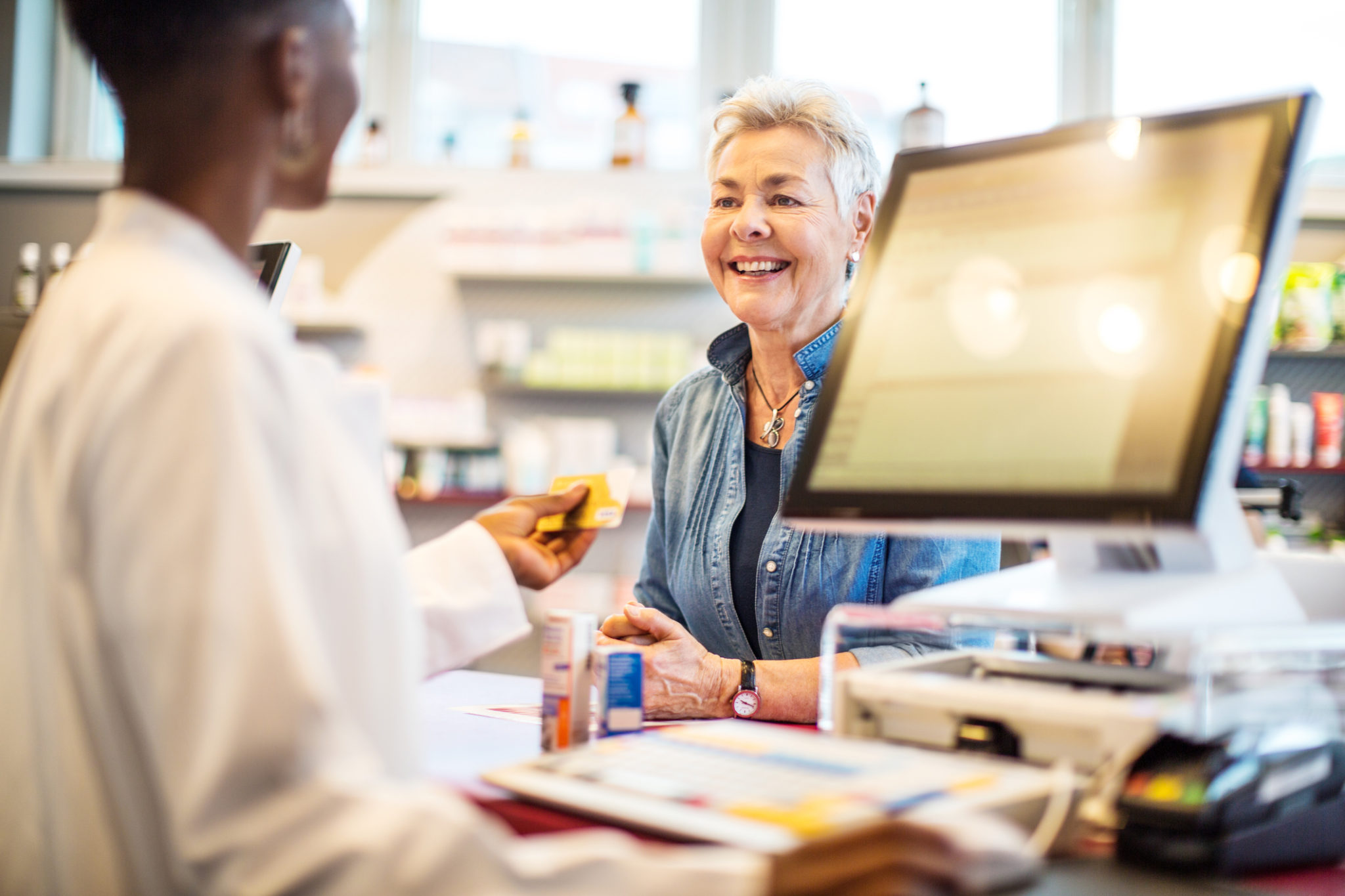 How do community pharmacies benefit from using a shared care record?